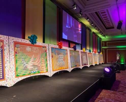 Custom created Satin Drapery Colorful Panels at an Event hung in alternating rainbow colors From Turn of Events Las Vegas Rental Drapery
