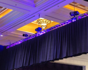 Purple Velour Drapery Hanging From a Truss from Turn of Events Las Vegas