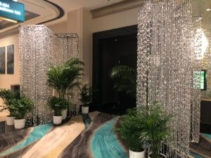 Silver Tear Drop Beaded Columns Flanking Event Entrance From Turn of Events Las Vegas Rental Drapery
