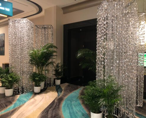 Silver Tear Drop Beaded Columns Flanking Event Entrance From Turn of Events Las Vegas Rental Drapery
