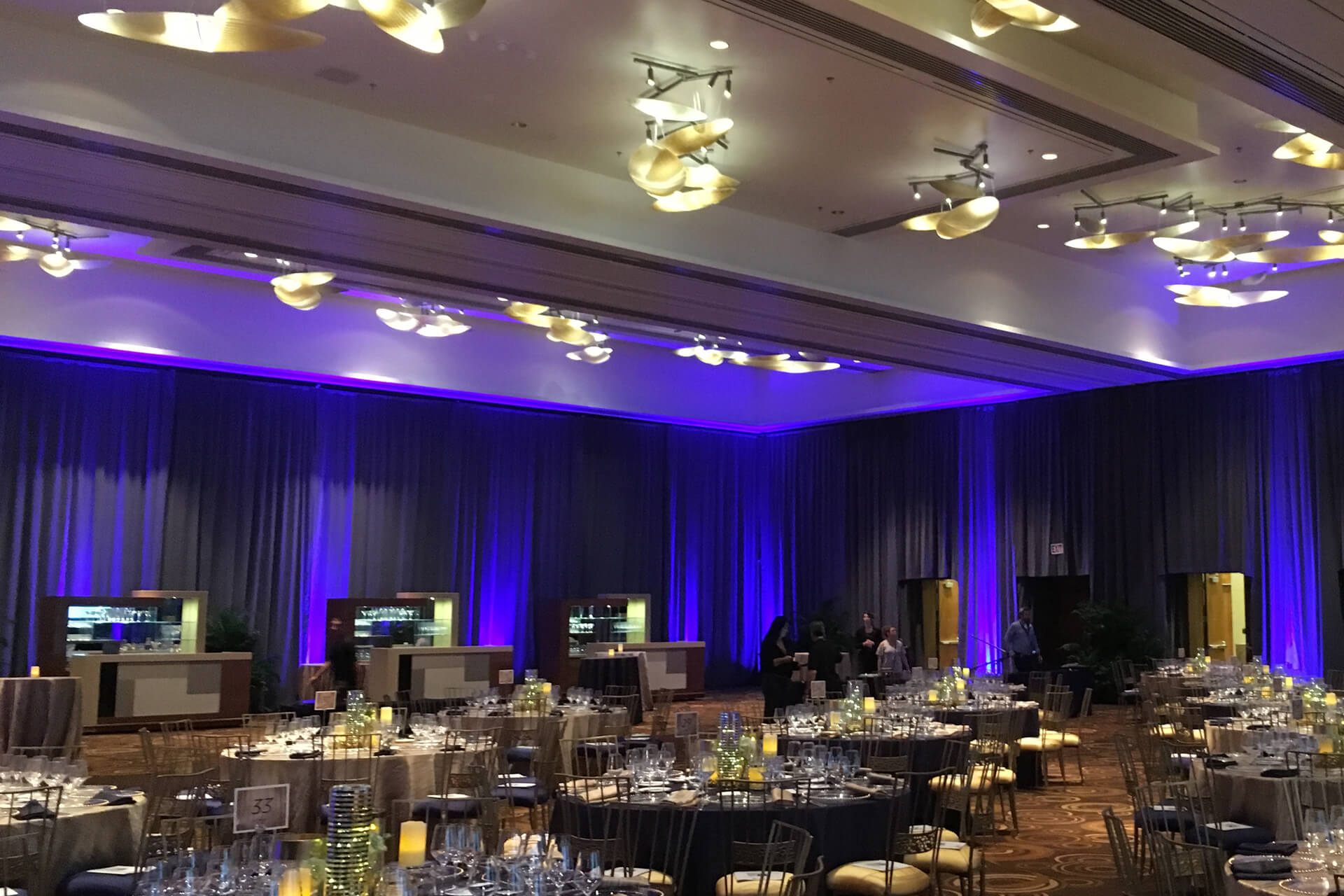 Turn of Events Uplit Room Drapery Event Party Gray Drape with Blue Lights