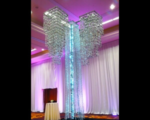 Floor Standing Quad Chandelier Décor From Turn of Events Las Vegas. Rental Drapery, Pipe and drape in Las Vegas. Duvetyne Drapery and More for all your drapery rental needs.